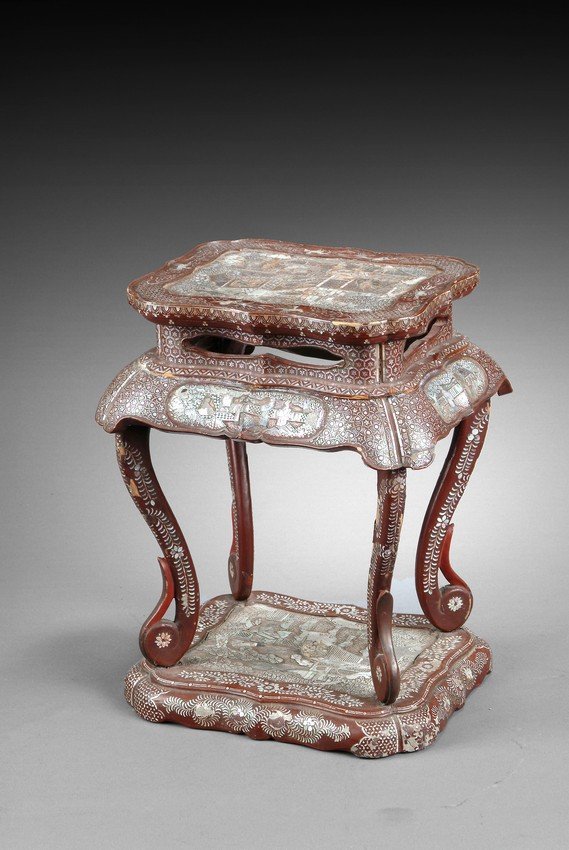 A MOTHER OF PEARL DECORATED LACQUER STAND: Of square top with rounded edges, four curved legs extends from high shouldering skirt, attached to a similar square base, all decorated with mother of pearl depicting flower and vine patterns, bird p