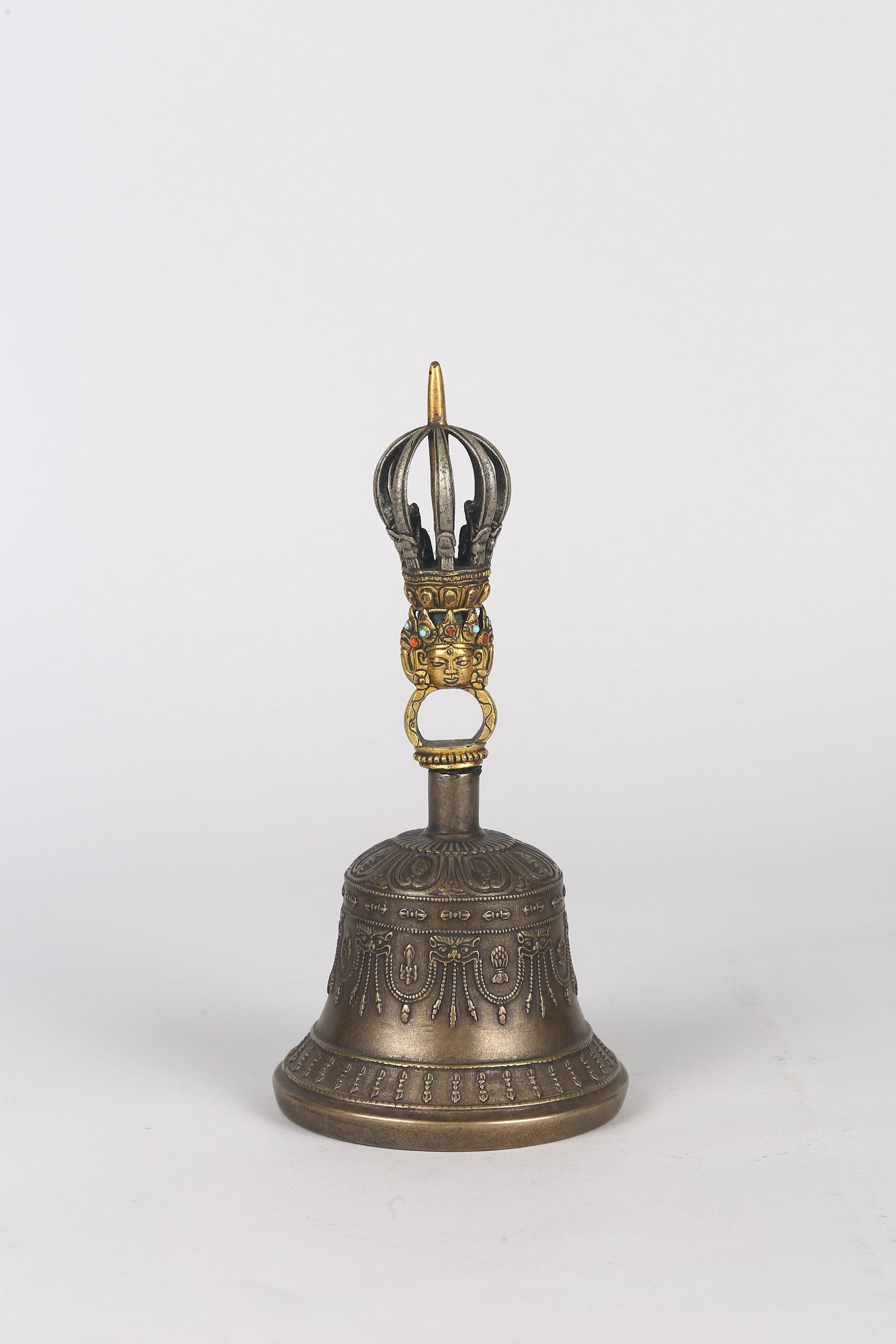 A Tibetan Copper and Alloy Bell: 西藏合金銅金剛鈴 The ritual bell cast in various copper alloys, the domed body finely decorated in relief with a band of vertical vajras above a series
