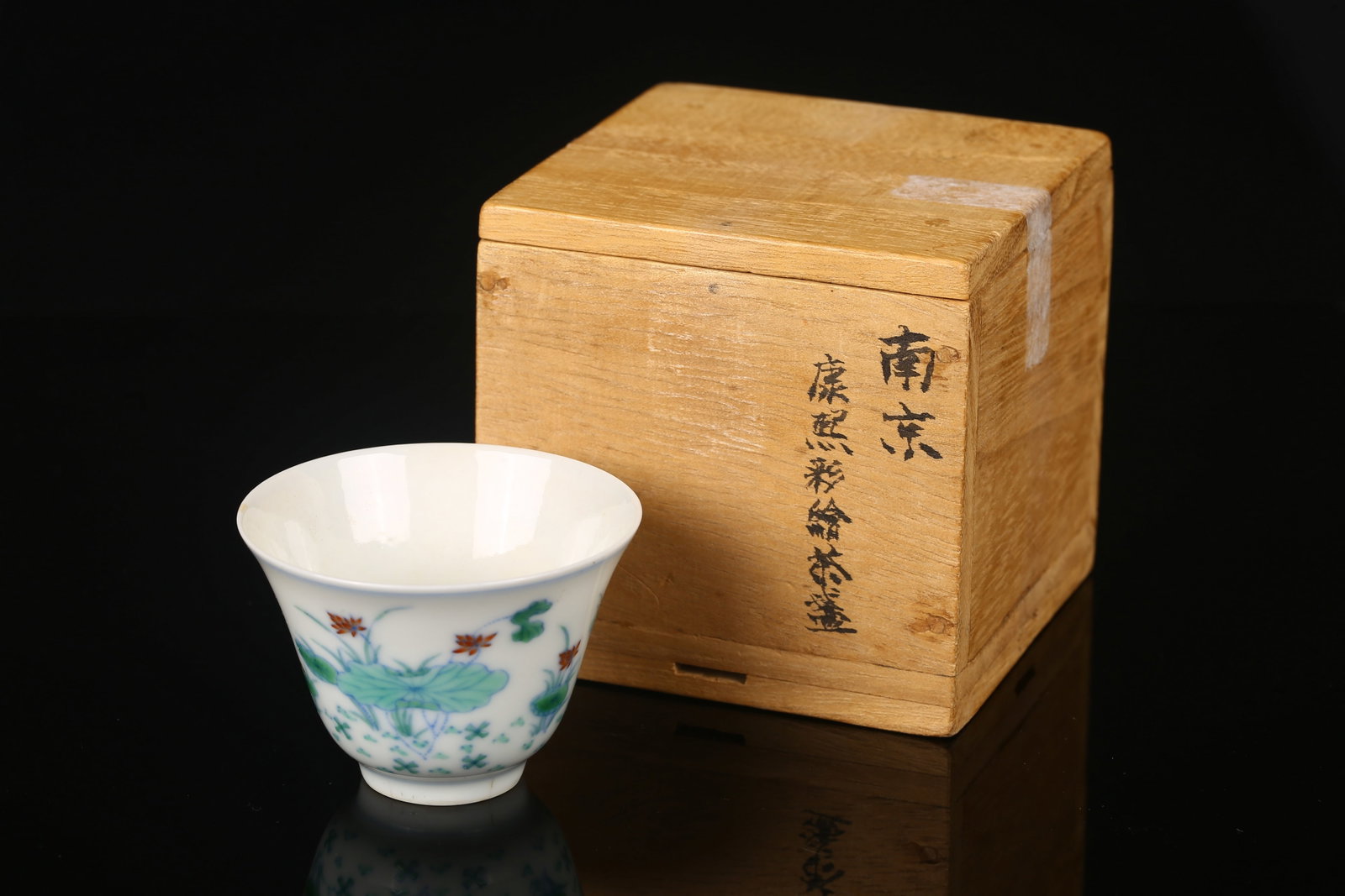 A Doucai 'Lotus Pond' Cup: 清 康熙款 鬥彩荷塘紋小杯 The finely potted, deep cup with gently flared sides, delicately painted in underglaze blue and vibrant overg