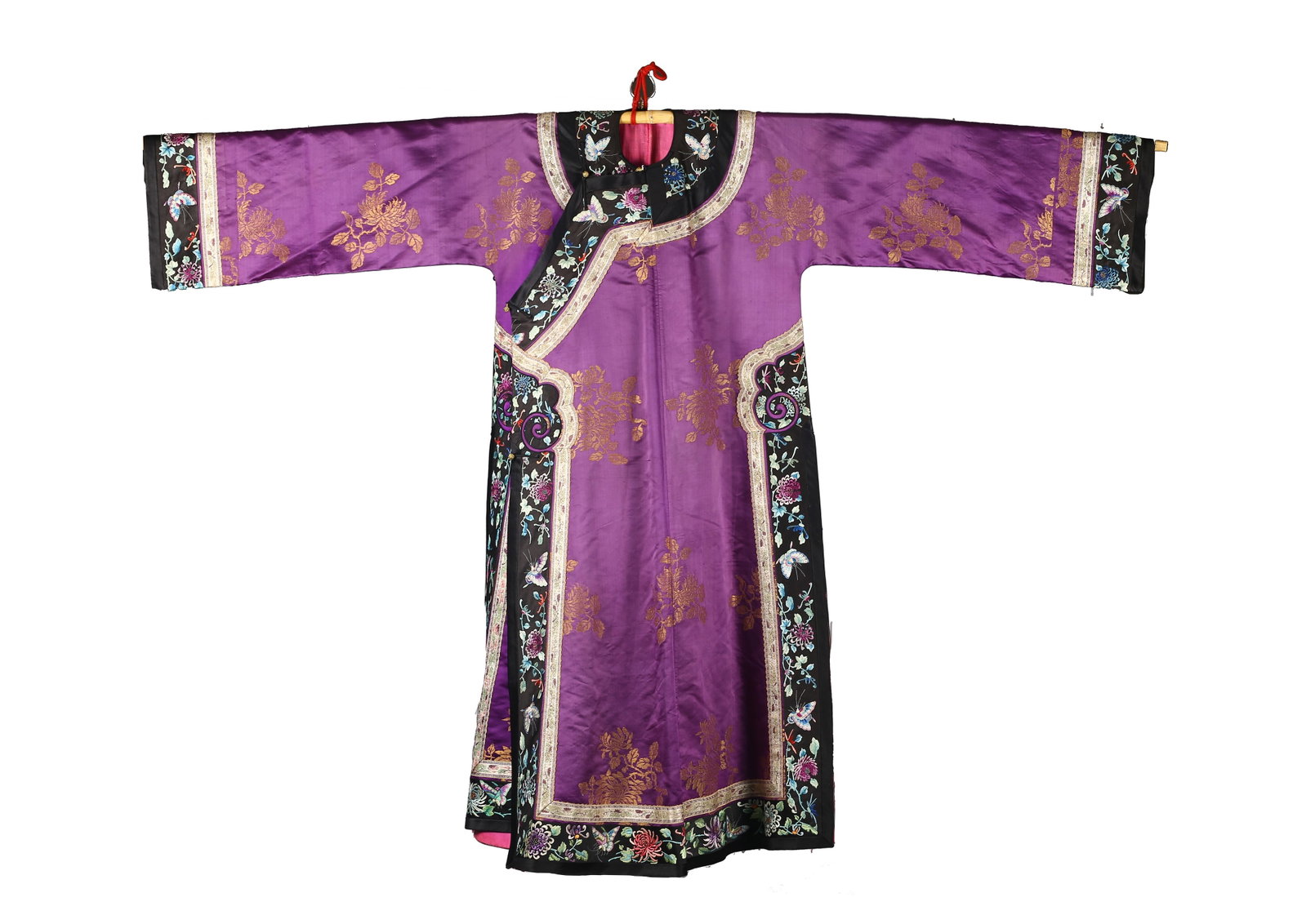 A Chinese Purple Satin Gold Embroidered Informal Robe: 清 紫緞金繡花紋氅衣 Of full-length form with wide sleeves, worked in rich purple satin woven with scattered floral roundels in gold thread, the