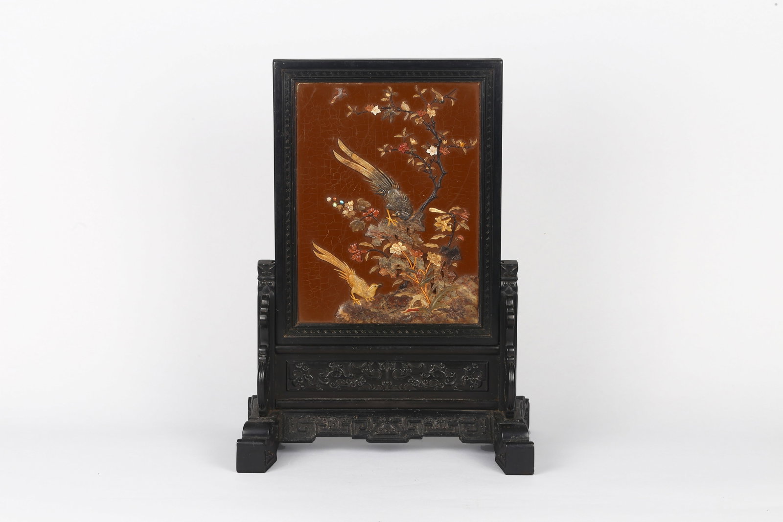 A Hardwood 'Soapstone' Inlaid Table Screen: 民國 紅木嵌壽山石花鳥紋插屏 The rectangular panel finely worked in relief against a crackled cinnabar ground, depicting tw