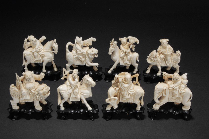 A set of 'Eight Immortals' ivory carvings: The set includes the complete Eight Immortals, each with its own ritual instrument and rides on different mounts, such as horse, qilin, buffalo, deer, elephant, and more; all with original wooden stan
