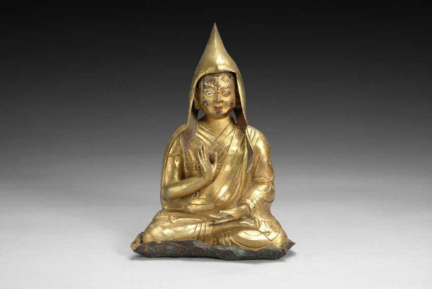A gilt bronze Dalai Lama statue