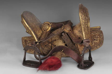 A rare carved gilt bronze 'Dragon' horse saddle set: The pierced mounts decorated in relief with four-clawed dragons with flaming pearls amongst dense vines patterns, the top decorated with birds and other auspicious symbols, the stirrup casted with two