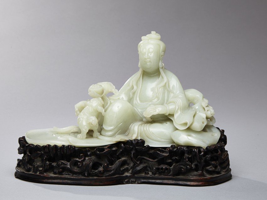 AN EXCEPTIONAL WHITE JADE FIGURE OF GUANYIN (1 of 10)