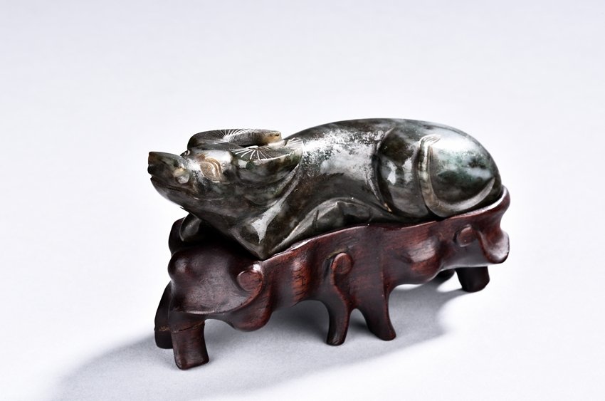A JADE CARVING OF RECUMBENT BUFFALO (1 of 5)