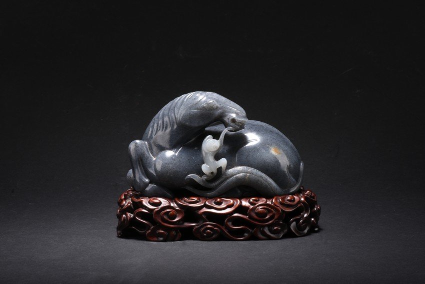 A BLACK AND WHITE JADE 'HORSE AND MONKEY' CARVING (1 of 2)