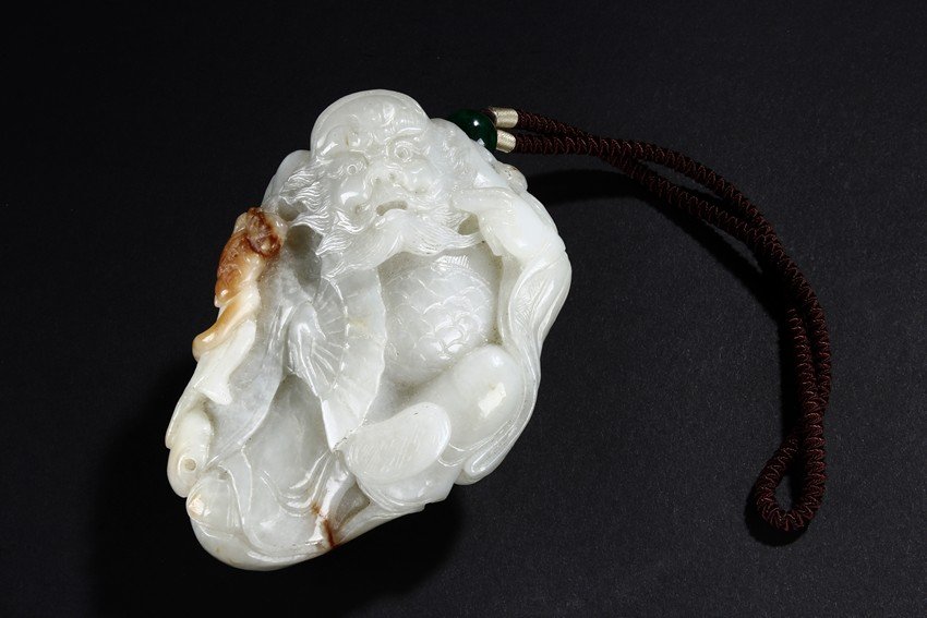 A WHITE JADE CARVING OF ZHONG KUI (1 of 6)