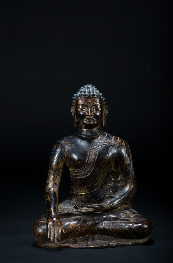 A BRONZE STATUE OF A SEATED BUDDHA (1 of 9)