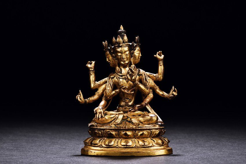 A GILT-BRONZE FIGURE OF USHNISHAVIJAYA (1 of 10)