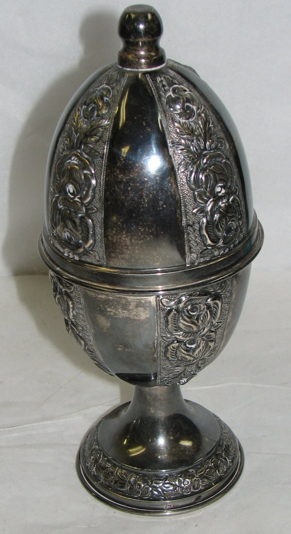 STERLING SILVER ETHROG BOX JUDAICA: TWO PIECE STERLING SILVER ESROG BOX OVAL OR EGG SHAPE IN FORM MEASSURING 9 INCHES IN HEIGHT BEARING MARKS OF ST 925 & HALLMARK.
