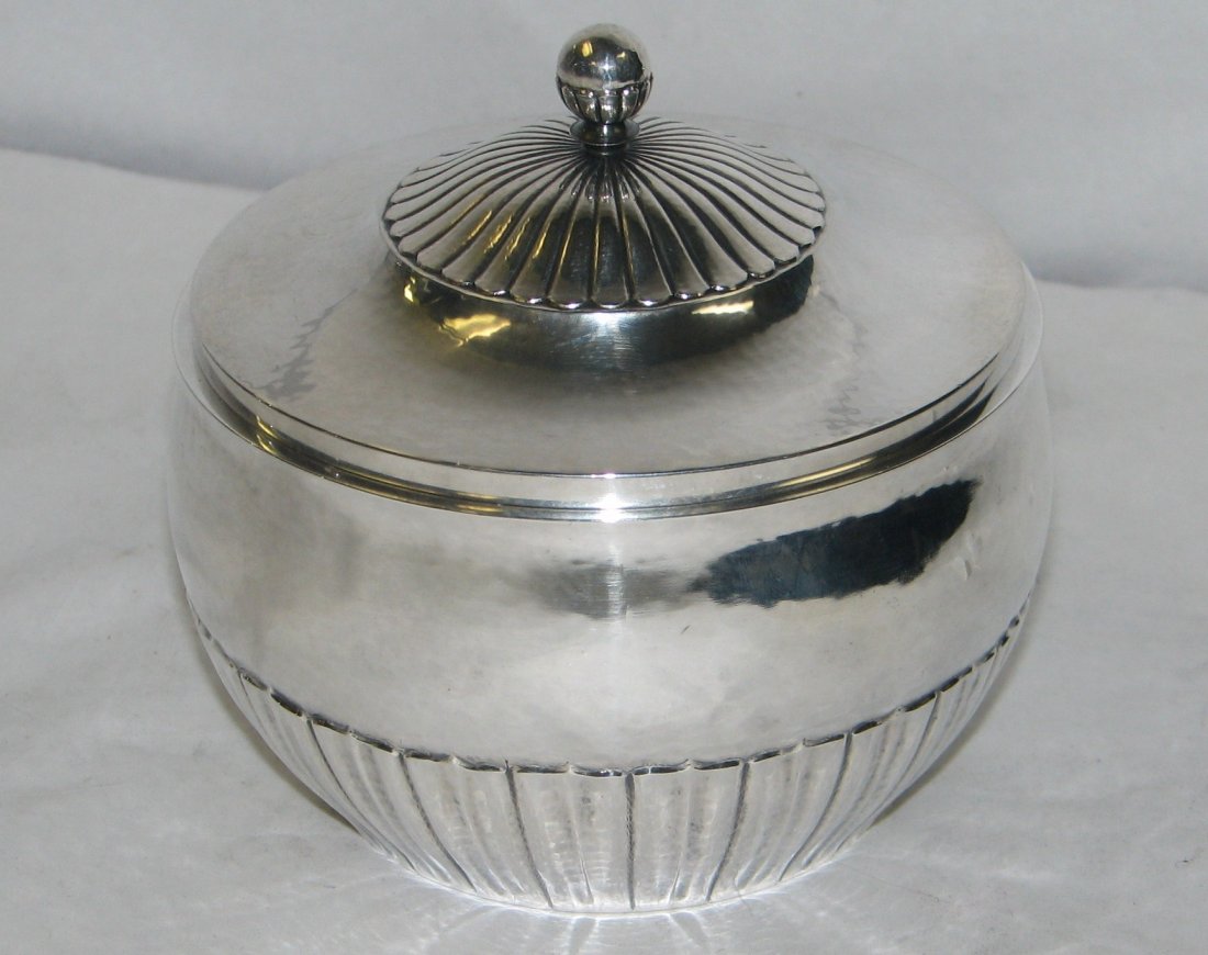 GEORG JENSEN COSMOS 45C SUGAR BOWL: A Danish sterling sugar bowl with cover by Georg Jensen, Copenhagen, designed by Johan Rohde, post 1945 Cosmos, # 45C Height: 4in x diameter: 4 1/4in, weight: 9 TROY OUNCES