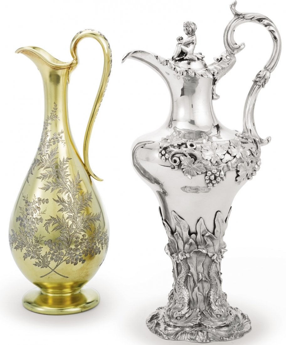 TWO VICTORIAN SILVER WINE EWERS 1842 & 1878: TWO VICTORIAN SILVER AND SILVER-GILT EWERS, JOHN EDWARD TERREY & CO. AND JAMES JOHNSON & JOHN WALKER, LONDON, 1842 AND 1878the first of baluster form, the base embossed and chased with dolphins and se