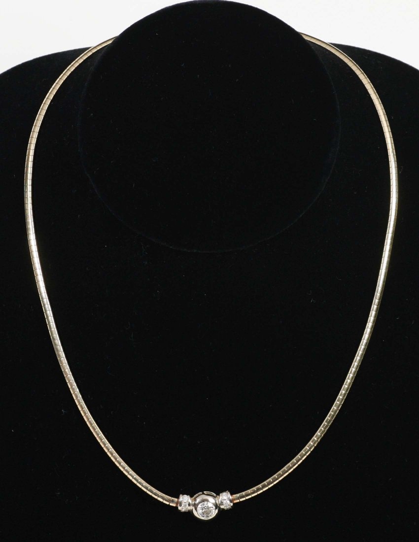 Diamond and 14kt Gold Necklace: 14K yellow gold necklace marked Italy, approximately .5 carat center diamond and three smaller diamonds flanking. 8.8 DWT17" long with . From the estate of Mavis Lopater, to benefit the Hans and Mavis