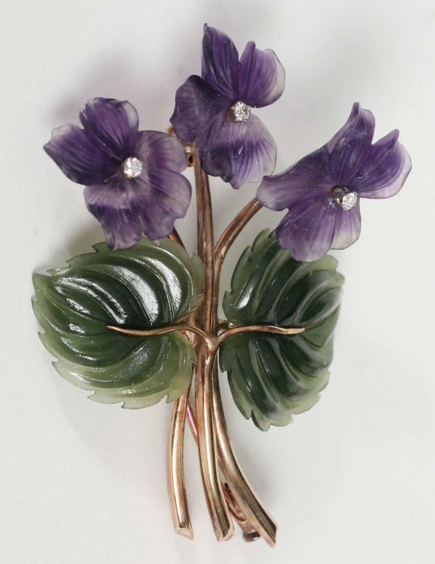 Carved Jade and Amethyst Pin with Diamonds 14kt Se: Pin consisting of two carved jade leaves, three curved amethyst leaves set with three round full cut diamonds weighing approximately .09cts, Mounted in 14kt yellow gold, with a series of 4 touch marks