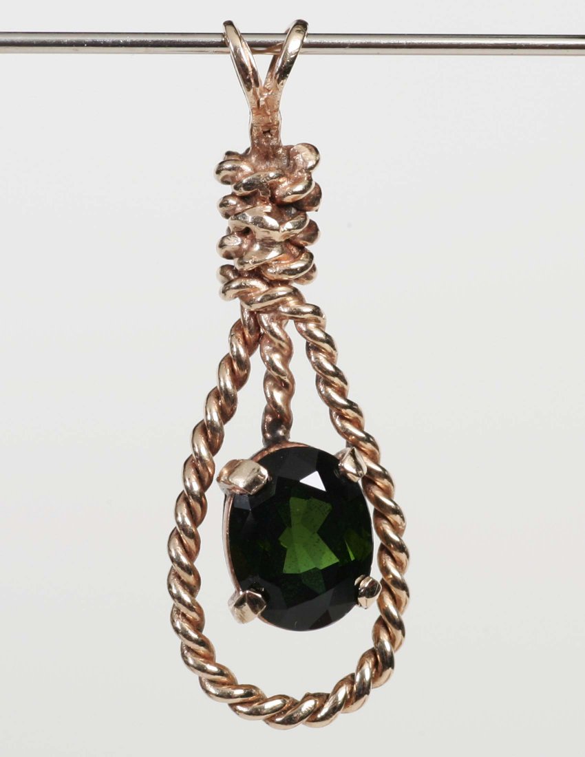 Oval Emarald Pendant in Gold Setting: Pendant consisting of one oval emerald (?) set in gold twisted rope setting. From the estate of Mavis Lopater, to benefit the Hans and Mavis Lopater Foundation