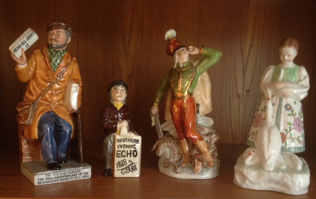 Doulton and Herend Figures: Royal Doulton "The News Vendor", Shorter and Sons News Vendor, Herend Figure #5599, Herend Figure #5555. Tallest is 8.5". From the estate of Mavis Lopater, to benefit the Hans and Mavis Lopater Founda