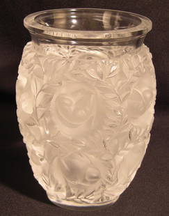 Lalique Bagatelle Crystal Vase: This vase is made of frosted crystal. It features a leaf pattern with birds nesting within those leaves. The vase stands 6-5/8”. The piece is signed on the bottom. There are some scuffs but no crack