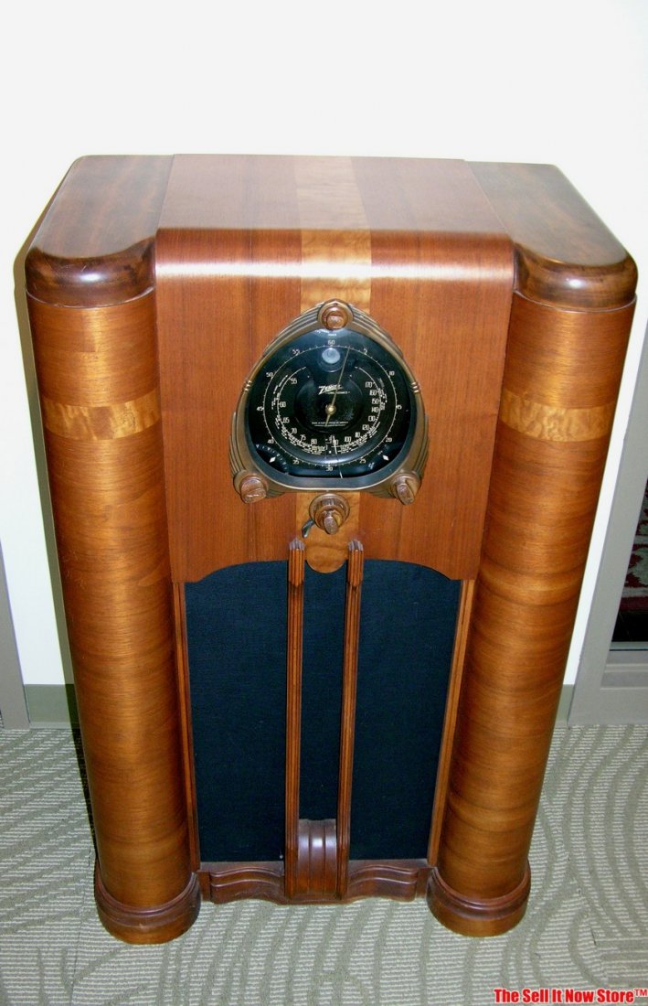 Restored Zenith Shutter Dial Console Tube Radio: This is a restored Zenith shutter dial console radio. It plays and has a great patina to an older refinish that was done years ago. This would make a great addition to that Zenith radio collection or