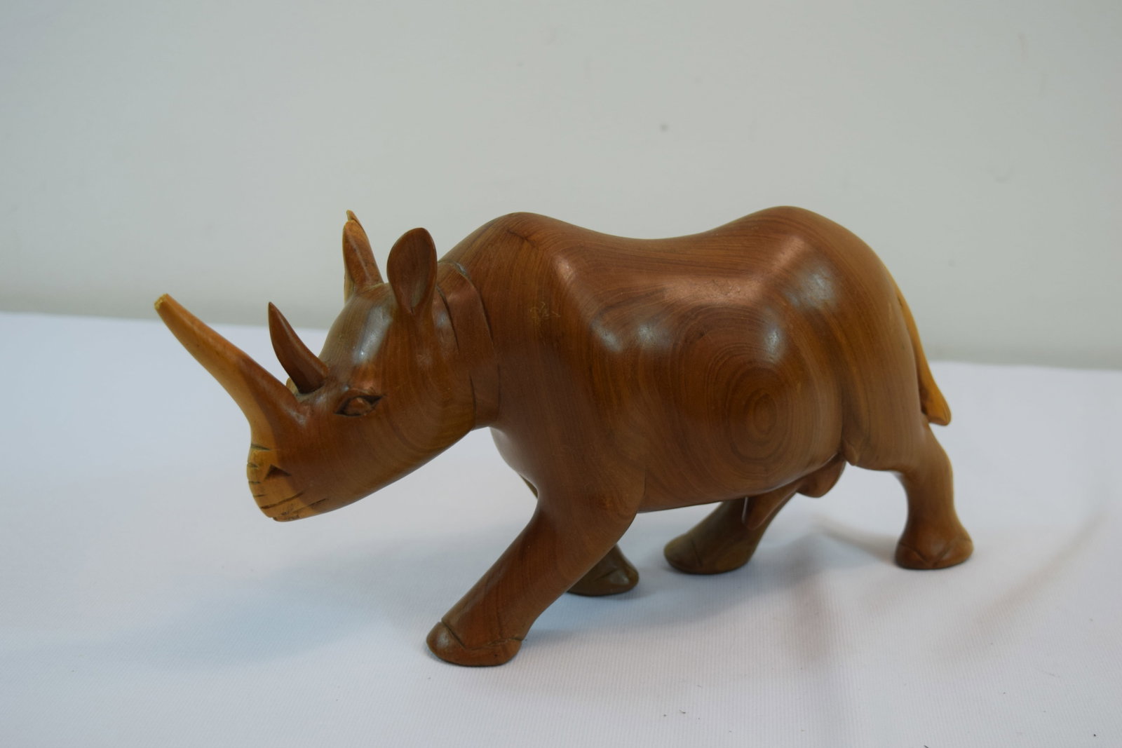 Hand-Carved teak wood rhino figurine, measures 3.5" x 5.5" x 12": Hand-Carved teak wood rhino figurine 3.5" x 5.5" x 12"