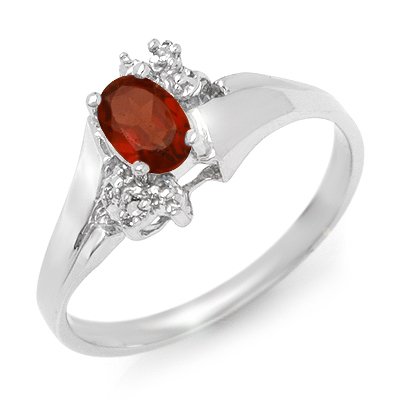 Genuine 0.52 ctw Garnet & Diamond Ring 10K White Gold: Genuine 0.52 ctw Garnet & Diamond Ring 10K White Gold * MSRP $520 ---- Diamond: 2 Round cut @ 0.02 ctw---- Clarity: SI-I---- Color: H-K----Gemstone: Natural Garnet----Gemstone color: Red----Gemstone q