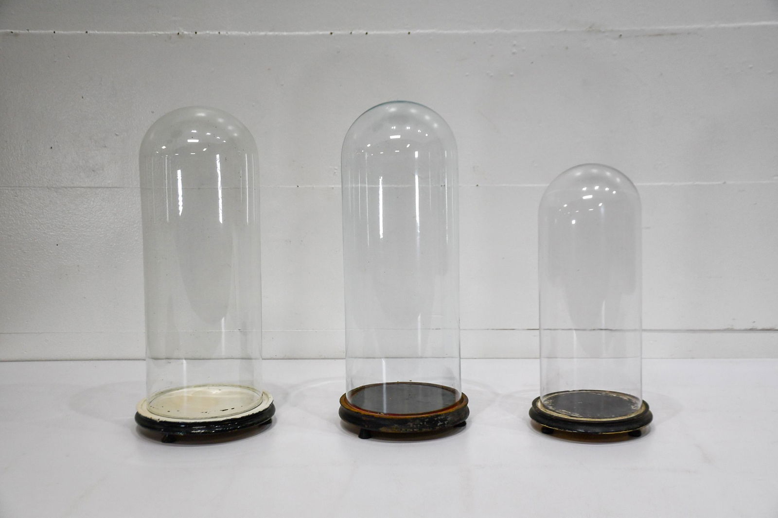 3pc. Lot of Glass Domes w/ Wooden Bases 20 1/2"H, 8: 3pc. Lot of Glass Domes w/ Wooden Bases 20 1/2"H, 8 7/8" diam. base, 7" diam. inside 20 1/2"H, 8 1/4" diam. base, 7 1/4" diam. inside 17"H, 7 1/2" diam. base, 6" diam. inside