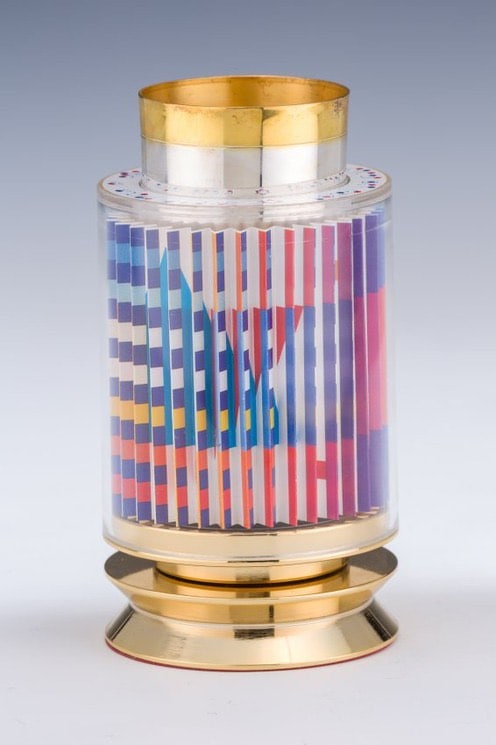 Yaacov Agam - Kiddush Cup: Artist: Yaacov AgamTitle: Kiddush CupYear: 1993Dimensions: 5 x 3 1/2 x 3 1/2 in.Edition: from the limited edition of 1800Medium: 24k Gold Plated Sterling Silver with Agamograph in Acrylic Condition: