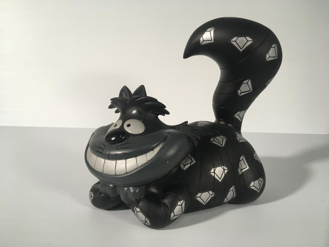 Span of Sunset x Disney - Cheshire Cat Diamond in the Rough Figurine: Artist: Span of Sunset x Disney Title: Cheshire Cat Diamond in the Rough Figurine Year: 2007 Dimensions: 8in. by 8in. Edition: From the Rare Limited Edition of 300