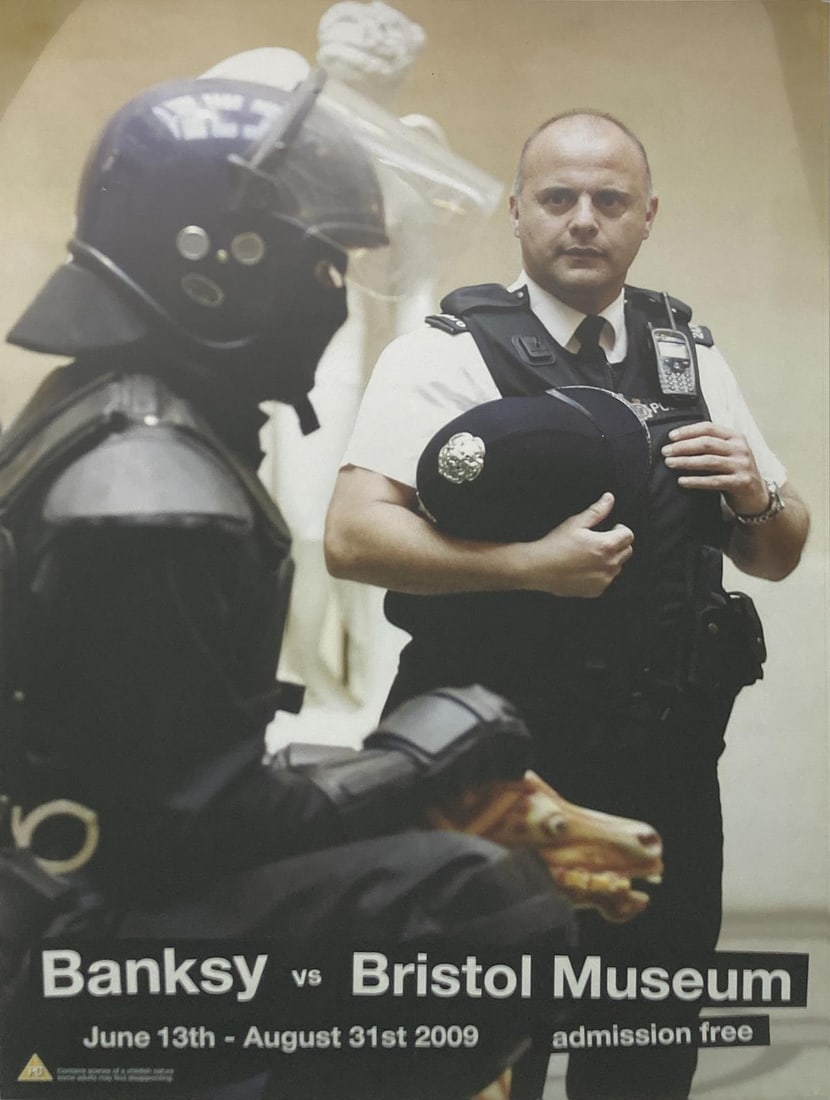 Banksy - Banksy VS Bristol Museum Poster: Artist: Banksy Title: Banksy VS Bristol Museum Poster Year: 2009 Dimensions: 24in. by 17in. Edition: From the rare limited edition Medium: Offset Lithograph Po