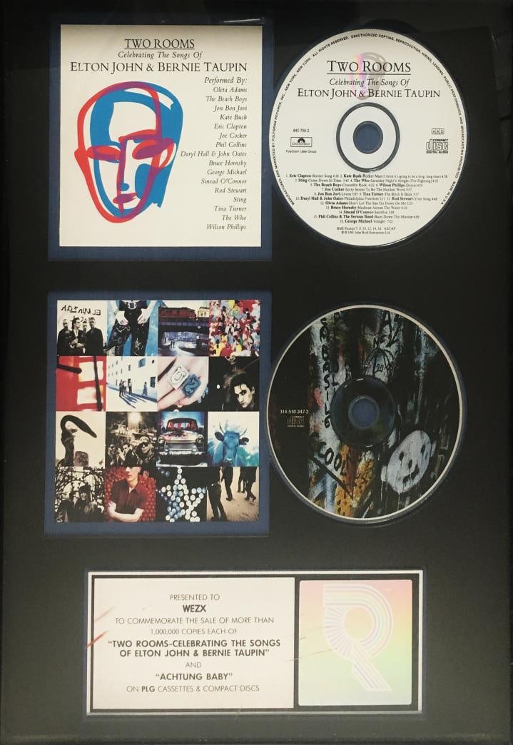 Elton John Bernie Taupin and U2 - One Million Copies Each Promotion: Artist: Elton John Bernie Taupin and U2 Title: One Million Copies Each Promotion Dimensions: 17in. by 13in. Edition: Unique One of a Kind Artwork Medium: Mixed Media CD Display Condition: Excellent
