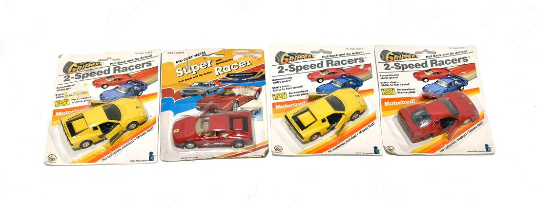 4 Super Speed Ferrari Racers in Packages: 4 Super Speed Ferrari Racers in Packages - Offered Without Reserve - There is NO ESTIMATE on this item. - 4 Super Speed Ferrari Racers in Packages. The packages do have some wear. They all have pull b