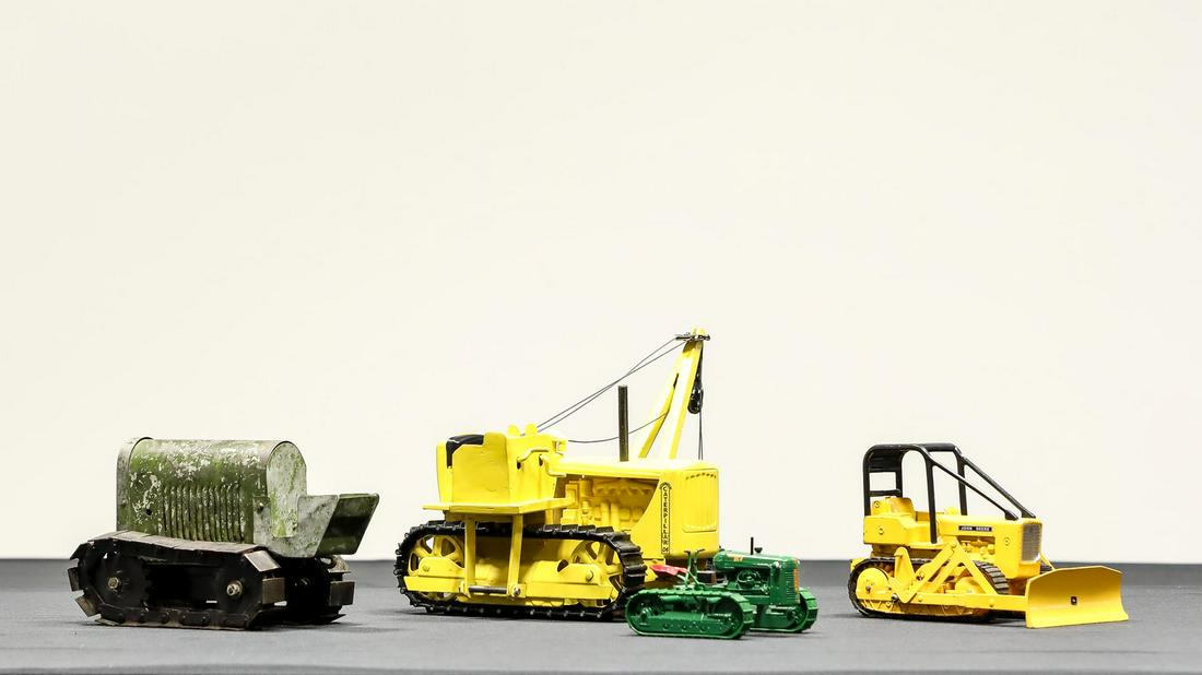 Collection of 4 Tractors on Treads: Collection of 4 Tractors on Treads - Offered Without Reserve - Starting life as a Doepke Caterpillar D6 Bulldozer, this big pressed steel toy was professionally converted into a one-of-a-kind pipe lay