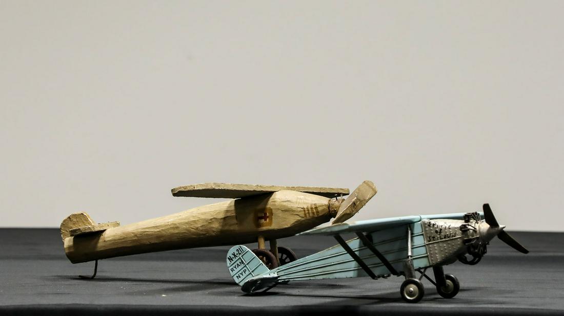 Two Spirit of St. Louis Airplanes: Two Spirit of St. Louis Airplanes - Offered Without ReserveTwo planes that represent the Spirit of St. Louis. The first is a rather rustic replica made from wood, carved and together, hand painted sig