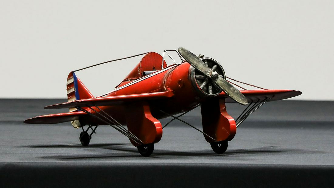 1930s Style Monoplane Decorator Item: 1930s Style Monoplane Decorator Item - Offered Without ReserveHand-crafted replica of a 1930s style monoplane open cockpit racer, painted red, made in China. 24" wingspan, 20" fuselage, 8" high