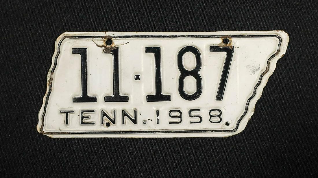 1958 Tennessee Motorcycle License Plate: 1958 Tennessee Motorcycle License Plate - Offered Without ReserveProduced in the basic shape of Tennessee, this feature black numbers on a white background, minor damage near one mounting hole, 8&rdqu