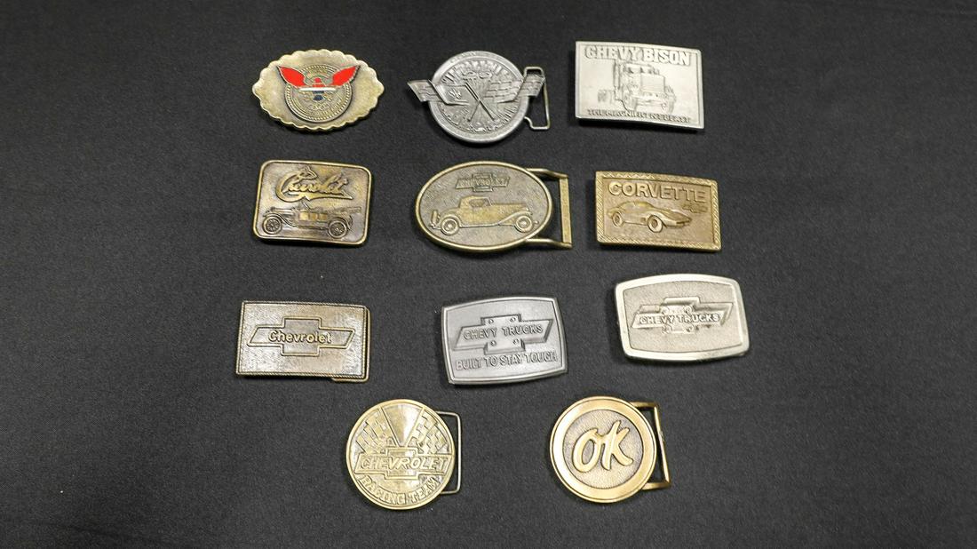 Collection of Chevrolet Related Belt Buckles: Collection of Chevrolet Related Belt Buckles - Offered Without ReserveMost from the 1970s and include profile of 1911 touring car, profile of 1932 Confederate roadster, bow-tie logo, two different Che