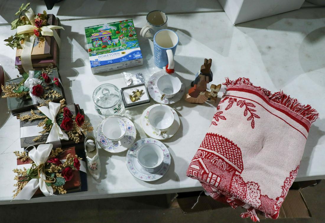 Decorative Items: Decorative Items - Offered Without Reserve4 tea cups and saucers, book centerpieces, puzzle, jewelry items, DeKalb County blanket, and other items