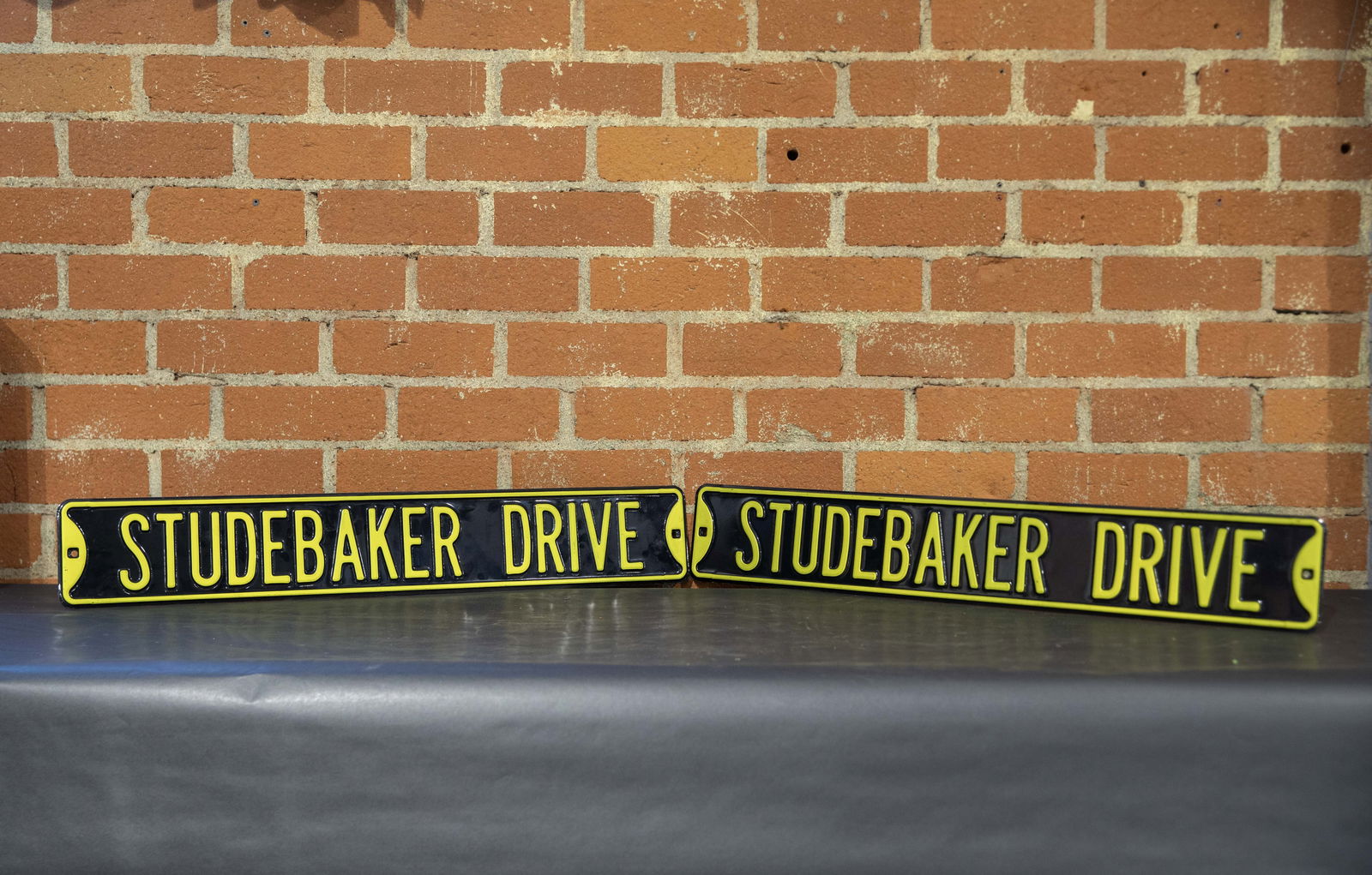 Studebaker Drive Metal Embossed Enamel Signs (1 of 2)