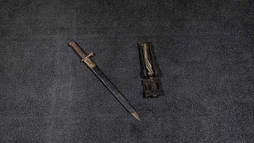 Metal Bayonet & 1/2 of a Gun Magazine