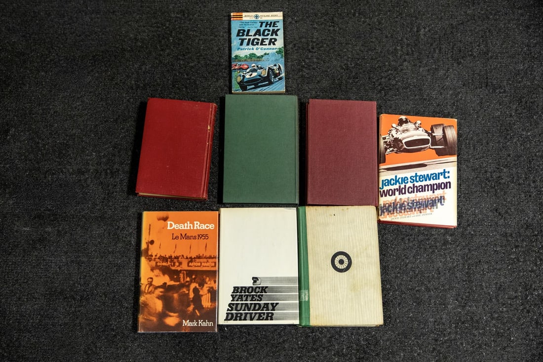 Eight Books on Racing Events and Drivers: Collection of Automotive Racing and related books including, *Automotive Giant of America* by Forbes & Foster; *Formula 2* by G. Grant; *Challenge Me the Race* by M. Hawthorn; *The Black Tiger* by P. 