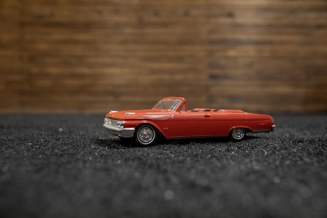 1962 Ford Sunliner Promotional Model: Original 1962 Ford factory-built promo model cast in Rangoon Red, features matching interior with black inserts, detailed chassis with multiple selling features, coaster model, excellent chrome needs