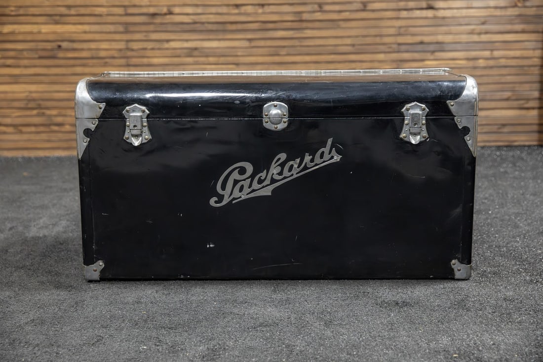 Early 1930s Motor Car Travel Trunk - Packard Script: This vintage travel trunk is constructed of sheet metal and wood with top access lid, fabric liner, nickel plated clasps, locks, and decorated corner protector plus vintage die-cut Packard script, app