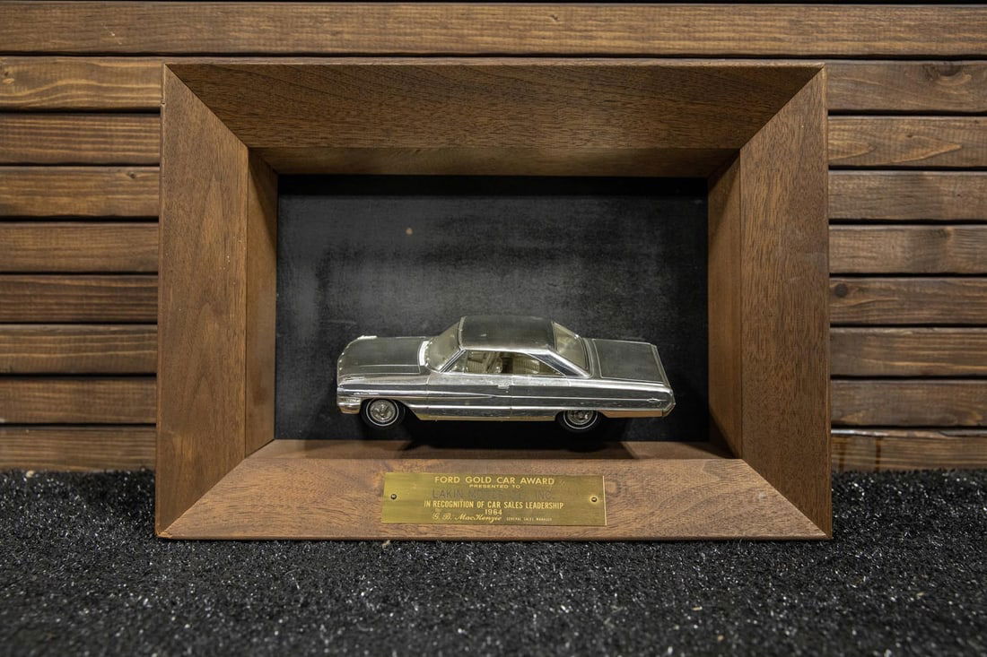 1964 Ford Gold Car Award: Presents special gold-tone-plated 1964 Ford Galaxie 500 XL hardtop mounted in mahogany shadow box display created by AMT for Ford, presented to Lakin Motor Co., of Lakin, Kansas in recognition of car