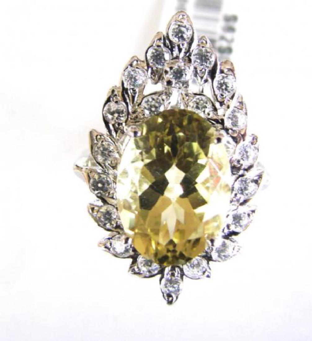 Lemon Topaz Creation Dia Ring 7.30Ct 18k W/g Overlay: Gem Type: Natural Lemon Topaz/Creation Diamond Item: Ring Lemon Topaz Weight :5.25 Carat Oval Facet Measurement: 14x10x7.5mm Clarity: VVS1, Color: Golden, Treatment: None Hardness 7,Origin, Brazil Cre