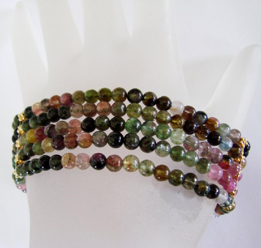 5 Lays Multicolored Tourmaline Bracelet with Y/G Filled: Gem Type: Natural Multicolored Tourmaline Qty: 1 Length: 7" Width: 1" Gold Filled Clasp, Beads, and Dividers (Not Gold Plated) Gemstone: Natural Multicolored Tourmaline Ball Shape Faceted Gemstone (4m