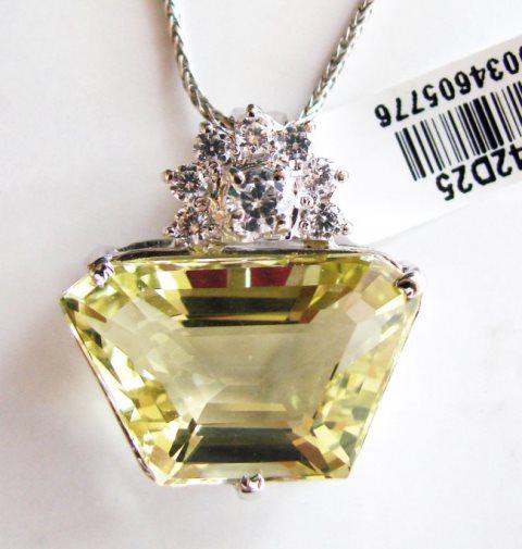 Lemon Topaz Pendant 25.43CT Overlay: Gem Type: Natural Lemon Topaz/Creation Diamond Quantity: 1 Lemon Topaz: Approx25.43Carat (Fancy Cut, Facet, Size: 18x11x5mm) Clarity: VS1, Color: Medium Yellow, Treatment: None Hardness 7 Origin, Braz