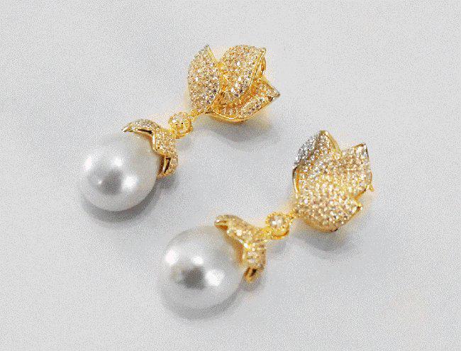 Baroque, South Sea Pearl Earrings 18k Y/g Gold Overlay: Gem Type: Pearl/ Creation white Diamond White Stone Total: Approximately 7.10 Carat, Clarity: VS1, Color: F Pearl: Luster: very good, Size: 14 mm Color: White/Creamy Length: 1.70 Inches Width:.75 Inch