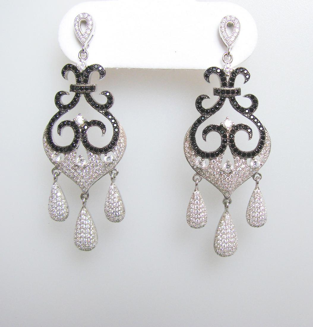 Creation Diamond Chandeliers Ear 3.74Ct 18k W/g Overlay: Creation Diamond Chandeliers Earrings and High Quality Item Item: Earrings Total: 3.74 carat Round brilliant (Clarity: VVS, Color: F) Creation Black Diamond Length: 2.1/4"x 3/4" inch Setting: Micro Pa