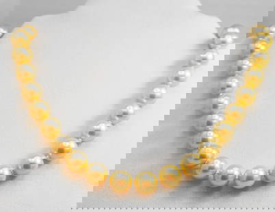 Necklace Swarovski Pearl Necklace 12 mm 925 Ball Clasp: Gems Type: Swarovski Crystal Pearl Measurement: 12 mm, 33 pieces Grade: AAA Color: Golden Swarovski Pearl Luster: Excellent Length: 18 Inches Ball Clasp Knot: Each in Between Threat: Silk <