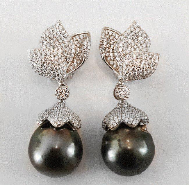 Baroque, Tahitian Pearl Earrings 18k W/g Gold Overlay: Gem Type: Tahitian Pearl/ Creation whit Diamond Stones Total: Approximately 7.10 Carat, Clarity: VS1, Color: F Pearl: Luster: very good, Size: 14.5 mm Color: Black/Gray Length: 1.70 Inches Width:.75 I